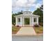 Community gazebo surrounded by landscaping and a concrete sidewalk at 230 Ryan Ln, Covington, GA 30014