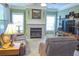 Comfortable living room features a fireplace, plush seating, and natural light at 230 Ryan Ln, Covington, GA 30014