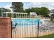 Community pool area with lounge chairs, tables, and pergola at 230 Ryan Ln, Covington, GA 30014