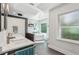 A bathroom with a soaking tub, double sinks, and a large window, promoting a spa-like atmosphere at 2356 Defoors Ferry Nw Rd, Atlanta, GA 30318