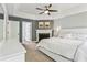 Bedroom with tray ceiling and a fireplace, offering a relaxing retreat space at 2356 Defoors Ferry Nw Rd, Atlanta, GA 30318