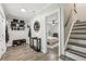 Welcoming foyer features stylish storage and a glimpse into a serene bedroom space at 2356 Defoors Ferry Nw Rd, Atlanta, GA 30318