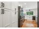 Kitchen with stainless steel appliances, modern cabinetry, and hardwood floors at 2356 Defoors Ferry Nw Rd, Atlanta, GA 30318
