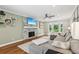 Comfortable living room with modern fireplace, plush sofa, and hardwood floors at 2356 Defoors Ferry Nw Rd, Atlanta, GA 30318