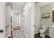 Hallway view of a modern powder room with contemporary fixtures and decor at 2356 Defoors Ferry Nw Rd, Atlanta, GA 30318