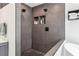This walk-in shower features dual shower heads, and built in shelving for storage at 2356 Defoors Ferry Nw Rd, Atlanta, GA 30318