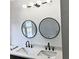 Bathroom with double sinks, granite countertop, and round mirrors at 2849 Windsor Forrest Ct, Atlanta, GA 30349
