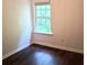 Cozy bedroom with natural light from a window and wood-look flooring at 2849 Windsor Forrest Ct, Atlanta, GA 30349