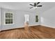 Spacious primary bedroom with hardwood flooring and double windows providing natural light at 2849 Windsor Forrest Ct, Atlanta, GA 30349