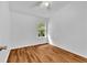 Bright bedroom with hardwood flooring and a single window providing natural light at 2849 Windsor Forrest Ct, Atlanta, GA 30349