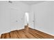Bright bedroom features wood-look flooring and neutral walls, complemented by white doors and trim at 2849 Windsor Forrest Ct, Atlanta, GA 30349