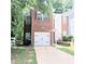 Cozy brick home showcasing an attached garage and proximity to neighboring houses at 2849 Windsor Forrest Ct, Atlanta, GA 30349