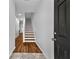 Bright foyer with wood floors and a staircase leading to the upper level at 2849 Windsor Forrest Ct, Atlanta, GA 30349