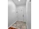 Bright foyer with tile floors and a white front door at 2849 Windsor Forrest Ct, Atlanta, GA 30349