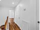 Bright hallway with wood floors and white doors, offering a clean aesthetic at 2849 Windsor Forrest Ct, Atlanta, GA 30349
