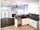 Modern kitchen and living room with stainless appliances and backsplash at 2849 Windsor Forrest Ct, Atlanta, GA 30349