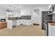 Bright kitchen featuring white cabinetry, tile floors, and a stylish backsplash at 2849 Windsor Forrest Ct, Atlanta, GA 30349