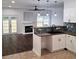 Modern kitchen featuring updated cabinets, stone backsplash, dark countertops, and stainless steel appliances at 2849 Windsor Forrest Ct, Atlanta, GA 30349