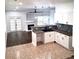 Modern kitchen and living room with stainless appliances and backsplash at 2849 Windsor Forrest Ct, Atlanta, GA 30349