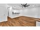 Bright living room with hardwood floors, fireplace, and partial kitchen view at 2849 Windsor Forrest Ct, Atlanta, GA 30349