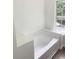 A view of a bathtub next to a window at 2849 Windsor Forrest Ct, Atlanta, GA 30349