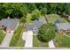 Aerial view of home highlighting large yard, fire pit, pool and tree lined perimeter at 2920 Waverly Place Dr, Dacula, GA 30019
