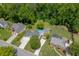 Aerial view showcasing spacious backyard with a pool, fire pit, lawn, and well-maintained landscaping at 2920 Waverly Place Dr, Dacula, GA 30019