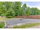Backyard with gravel area, wooden fence and fire pit perfect for outdoor entertaining at 2920 Waverly Place Dr, Dacula, GA 30019