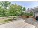Spacious backyard deck with a view of the lush backyard, including a pool and mature trees at 2920 Waverly Place Dr, Dacula, GA 30019