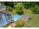 A backyard featuring an above ground pool, deck, and fire pit surrounded by a wooden fence at 2920 Waverly Place Dr, Dacula, GA 30019