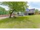 Expansive lawn and backyard featuring a pool and fire pit, perfect for outdoor enjoyment at 2920 Waverly Place Dr, Dacula, GA 30019