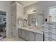 Bathroom featuring double sinks with neutral cabinets and countertops at 2920 Waverly Place Dr, Dacula, GA 30019