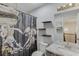 Cozy bathroom featuring a vanity with granite countertops and a shower/tub combo at 2920 Waverly Place Dr, Dacula, GA 30019