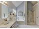 Bright bathroom with a dual vanity, a separate shower, and a deep soaking tub at 2920 Waverly Place Dr, Dacula, GA 30019