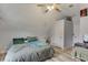 Bedroom with an angled ceiling, featuring unique decorations, a bed, and extra room for lounging at 2920 Waverly Place Dr, Dacula, GA 30019