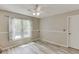 Relaxing bedroom with natural light and neutral walls, featuring two large windows at 2920 Waverly Place Dr, Dacula, GA 30019