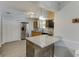 Updated kitchen featuring stainless steel appliances, wood cabinets, granite countertops and breakfast bar at 2920 Waverly Place Dr, Dacula, GA 30019