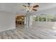 Spacious living room showing view into the kitchen, with natural light and modern flooring at 2920 Waverly Place Dr, Dacula, GA 30019