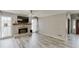 Inviting living room with a decorative brick fireplace, gray flooring, and access to the foyer at 2920 Waverly Place Dr, Dacula, GA 30019