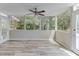 Bright sunroom with large windows offering natural light and serene views of the yard at 2920 Waverly Place Dr, Dacula, GA 30019