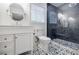 Modern bathroom with decorative tile floors, a white vanity, an enclosed shower, and natural light at 4493 Orleans Dr, Dunwoody, GA 30338