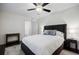 Cozy bedroom with dark wood floors, a queen-sized bed, side tables, and neutral-colored walls at 4493 Orleans Dr, Dunwoody, GA 30338