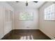 Bedroom with hardwood floors, closet and dual windows providing natural light at 4493 Orleans Dr, Dunwoody, GA 30338