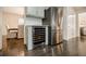 Stylish kitchen featuring a wine cooler, stainless steel refrigerator, and hardwood flooring at 4493 Orleans Dr, Dunwoody, GA 30338