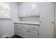 Bright laundry room with storage cabinets and countertop space at 4493 Orleans Dr, Dunwoody, GA 30338