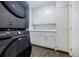 Clean laundry room with modern appliances and ample storage cabinets at 4493 Orleans Dr, Dunwoody, GA 30338