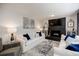 Cozy living room with fireplace, comfortable seating, and plenty of natural light at 4493 Orleans Dr, Dunwoody, GA 30338