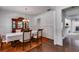 Elegant dining room with wainscoting, chandelier, and views into other rooms at 4619 Sweetwater Ave, Powder Springs, GA 30127