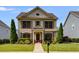 Charming two-story home featuring a well-manicured lawn and craftsman-style architectural details at 4619 Sweetwater Ave, Powder Springs, GA 30127