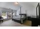 Main bedroom with a four-poster bed, sitting area, ensuite bathroom, and ample natural light at 4619 Sweetwater Ave, Powder Springs, GA 30127